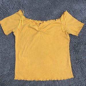 Cute mustard shirt, over the shoulder